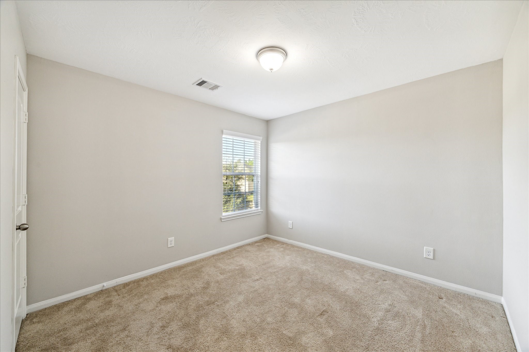 5710 Mid Way Kingwood, TX 77339 - Photo 13 of 15 a view of an empty room with a window