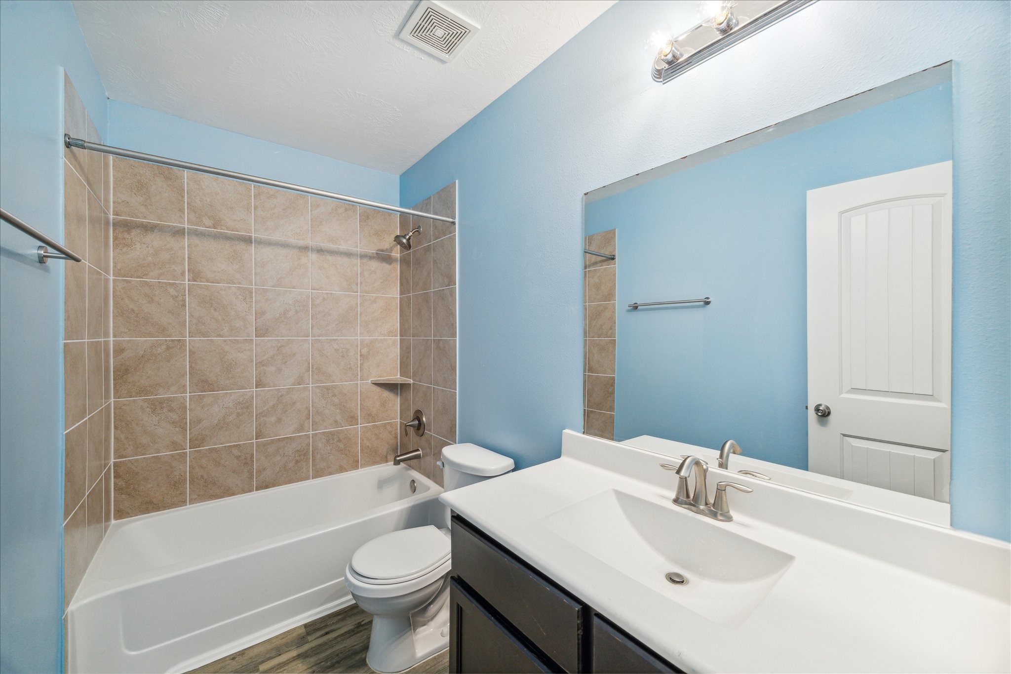 5710 Mid Way Kingwood, TX 77339 - Photo 14 of 15 a bathroom with a sink a toilet and shower