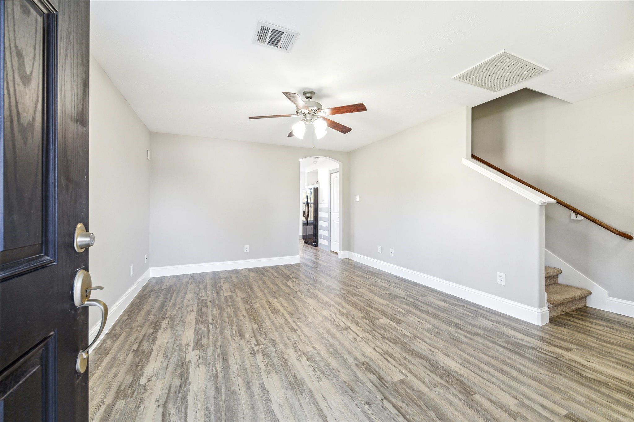 5710 Mid Way Kingwood, TX 77339 - Photo 2 of 15 wooden floor in an empty room with a window