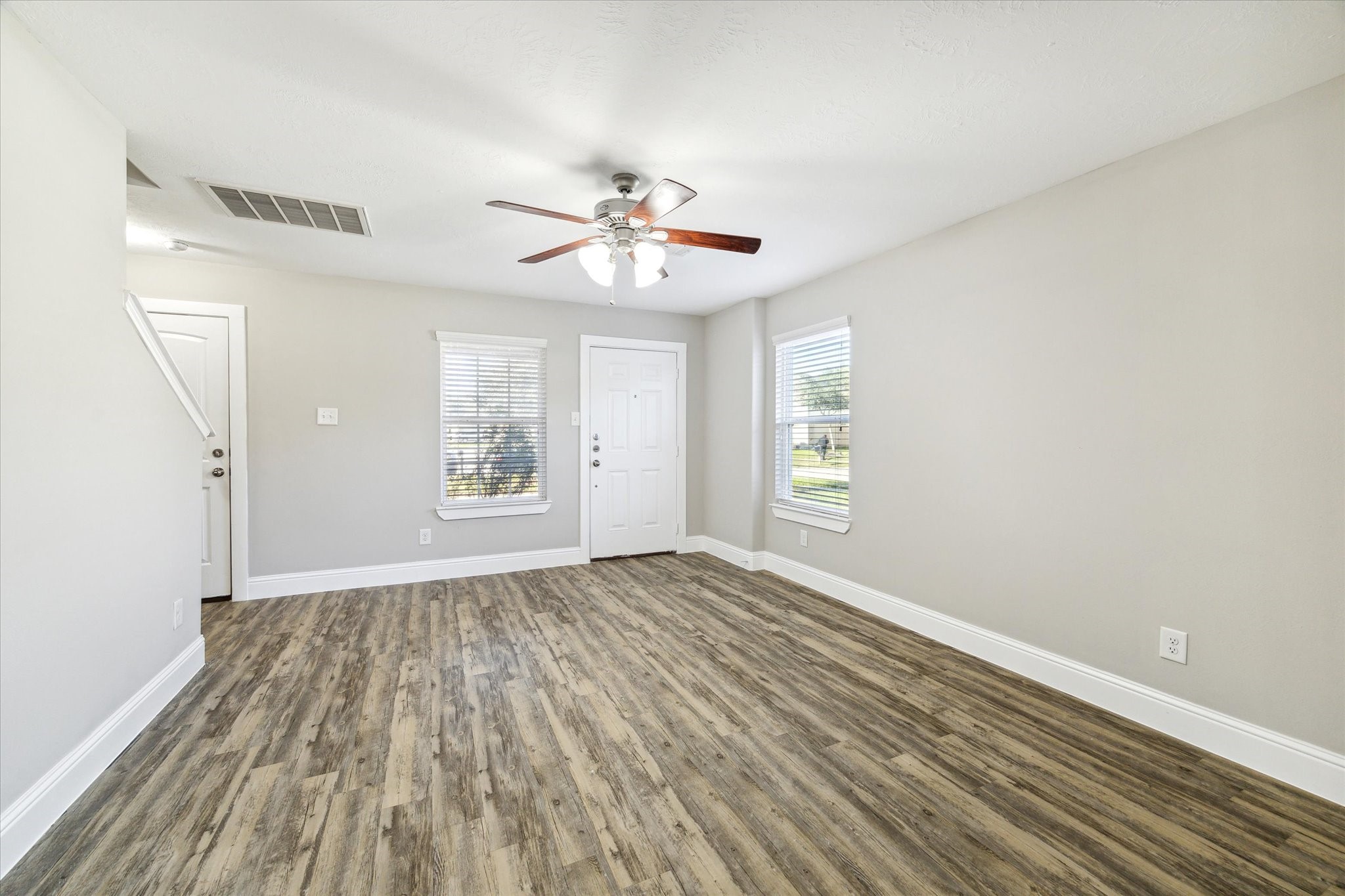 5710 Mid Way Kingwood, TX 77339 - Photo 3 of 15 wooden floor in an empty room with a window