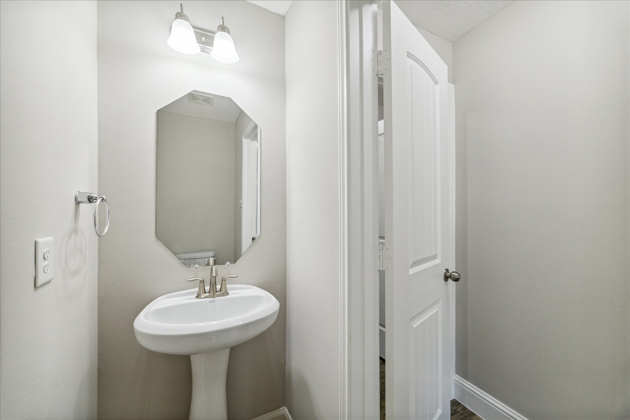 5710 Mid Way Kingwood, TX 77339 - Photo 6 of 15 a bathroom with a sink and a mirror