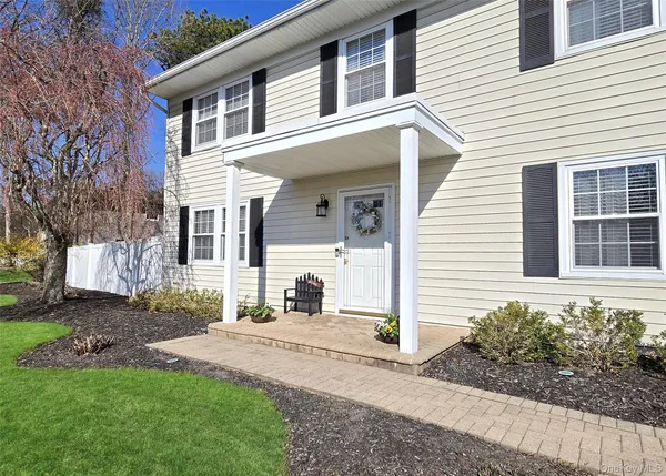 front view of a house with a yard
