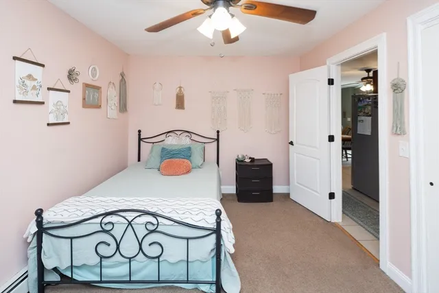 a bedroom with furniture and a chandelier