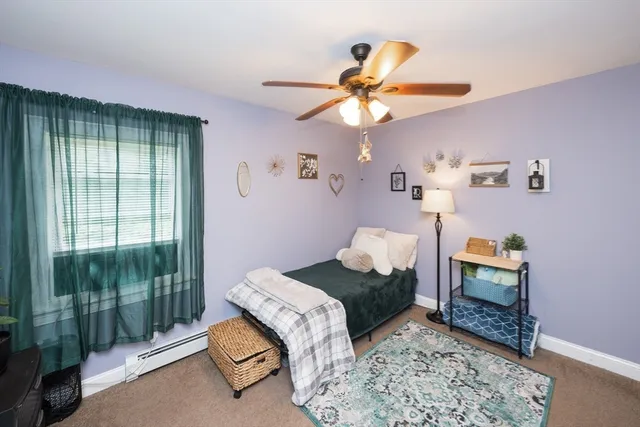 a bedroom with a bed and a mirror