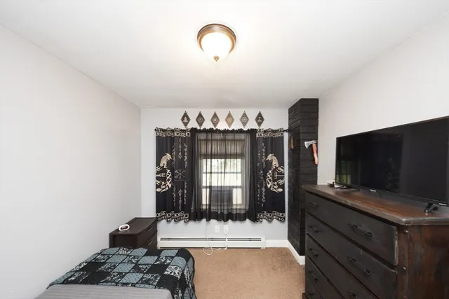 a room with furniture and a flat screen tv