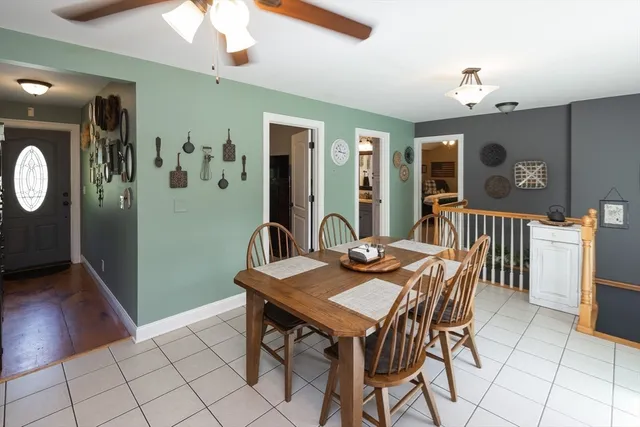 a view of a dining room with furniture and chandelier