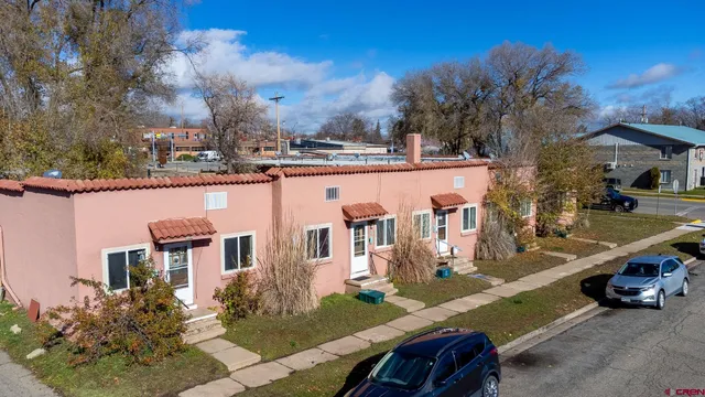 an aerial view of a house with a yard