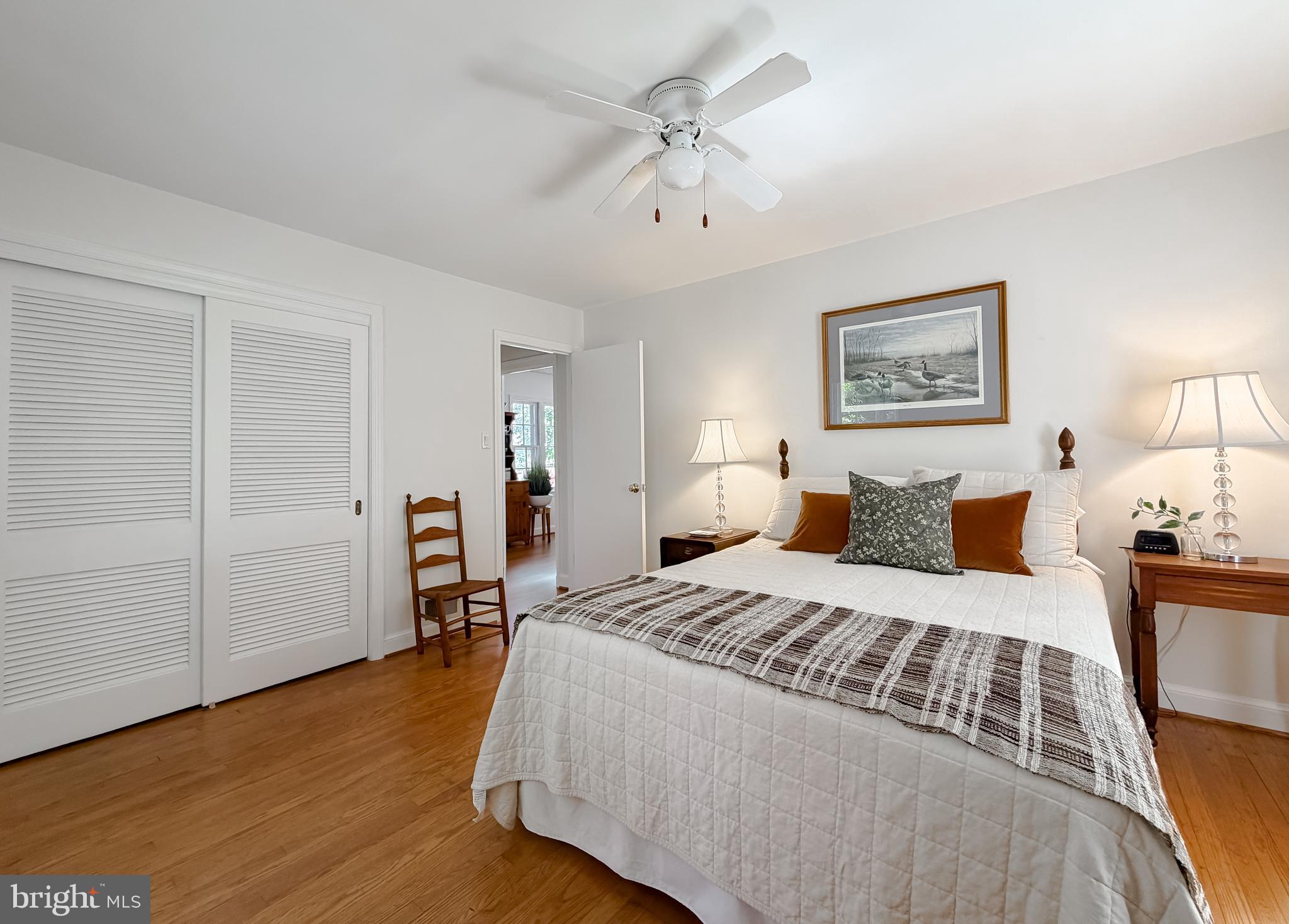 23761 Kingston Creek Road California, MD 20619 - Photo 14 of 61 a bedroom with a bed and a chandelier