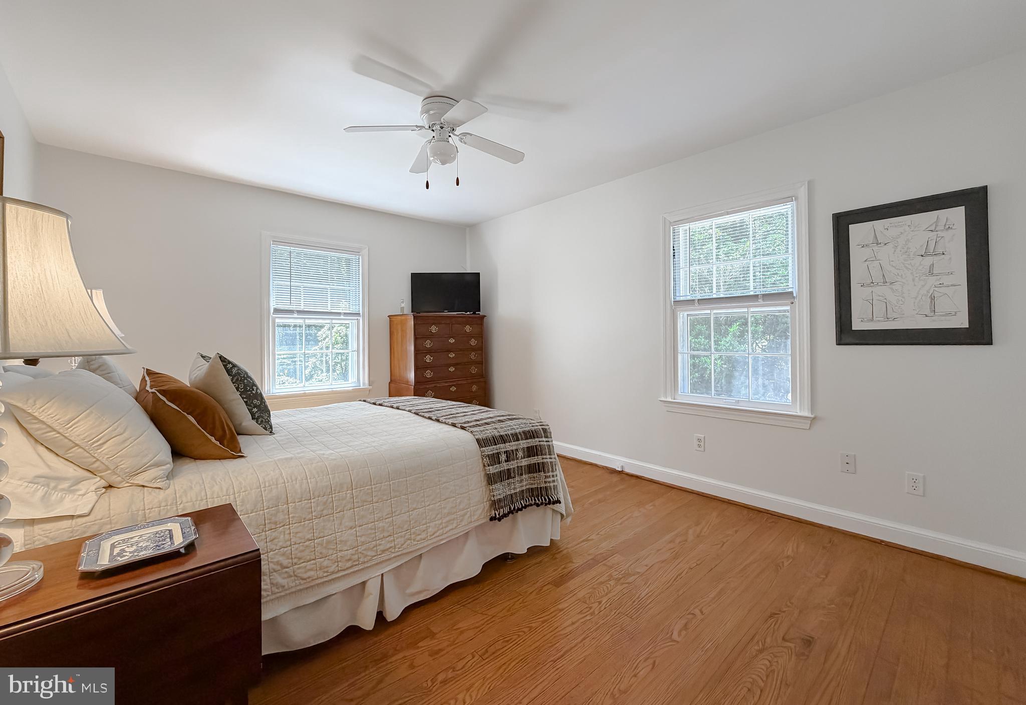 23761 Kingston Creek Road California, MD 20619 - Photo 15 of 61 a bedroom with a large bed and a window