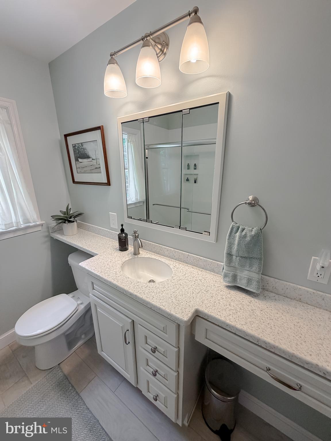 23761 Kingston Creek Road California, MD 20619 - Photo 18 of 61 a bathroom with a toilet a sink and mirror