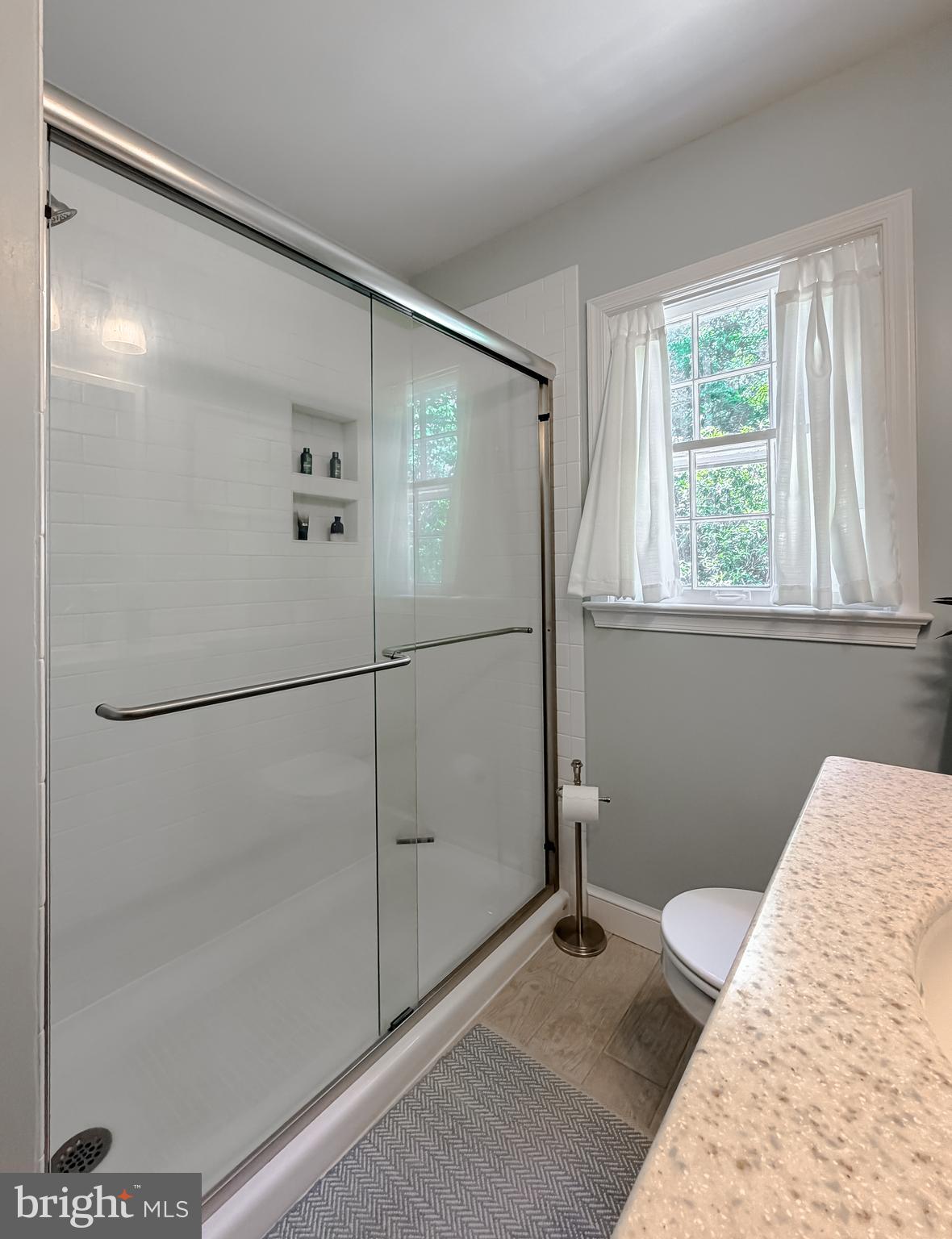 23761 Kingston Creek Road California, MD 20619 - Photo 19 of 61 a bathroom with a bathtub and a shower