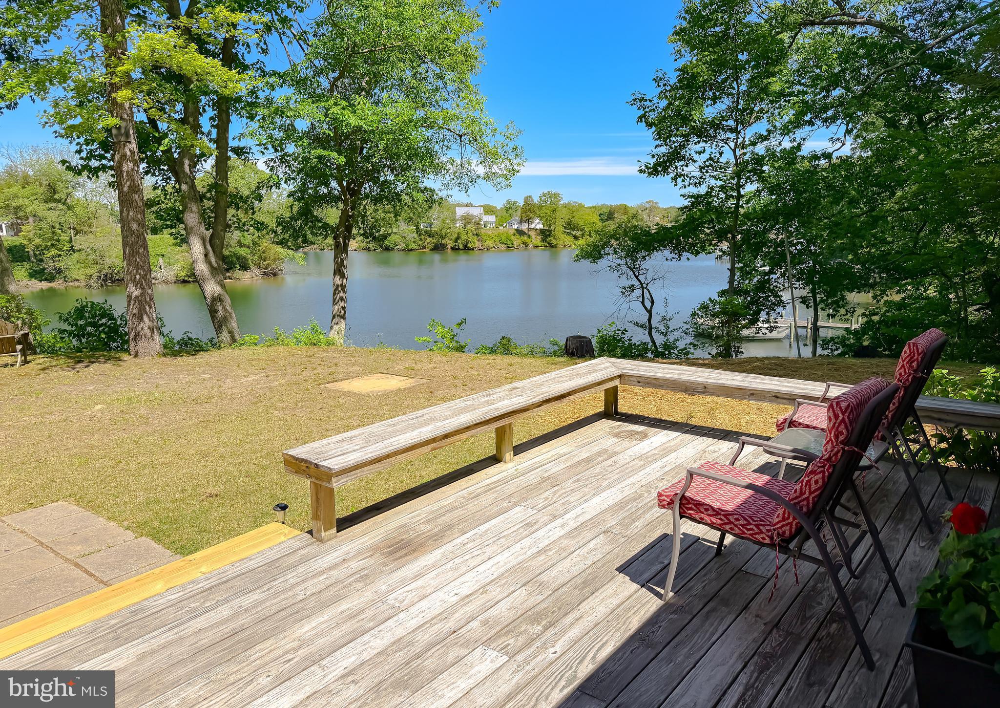 23761 Kingston Creek Road California, MD 20619 - Photo 37 of 61 a view of a patio with chairs and wooden floor