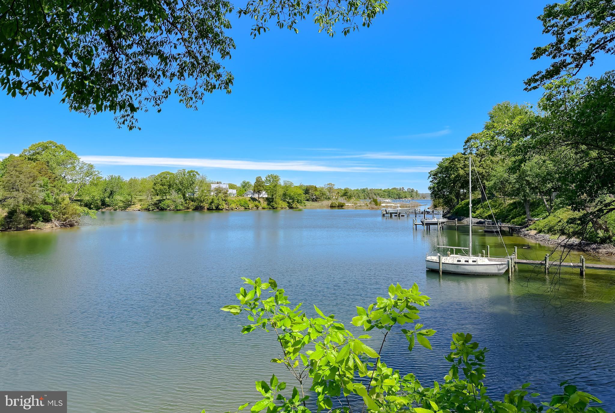 23761 Kingston Creek Road California, MD 20619 - Photo 38 of 61 a view of a lake with houses in the back