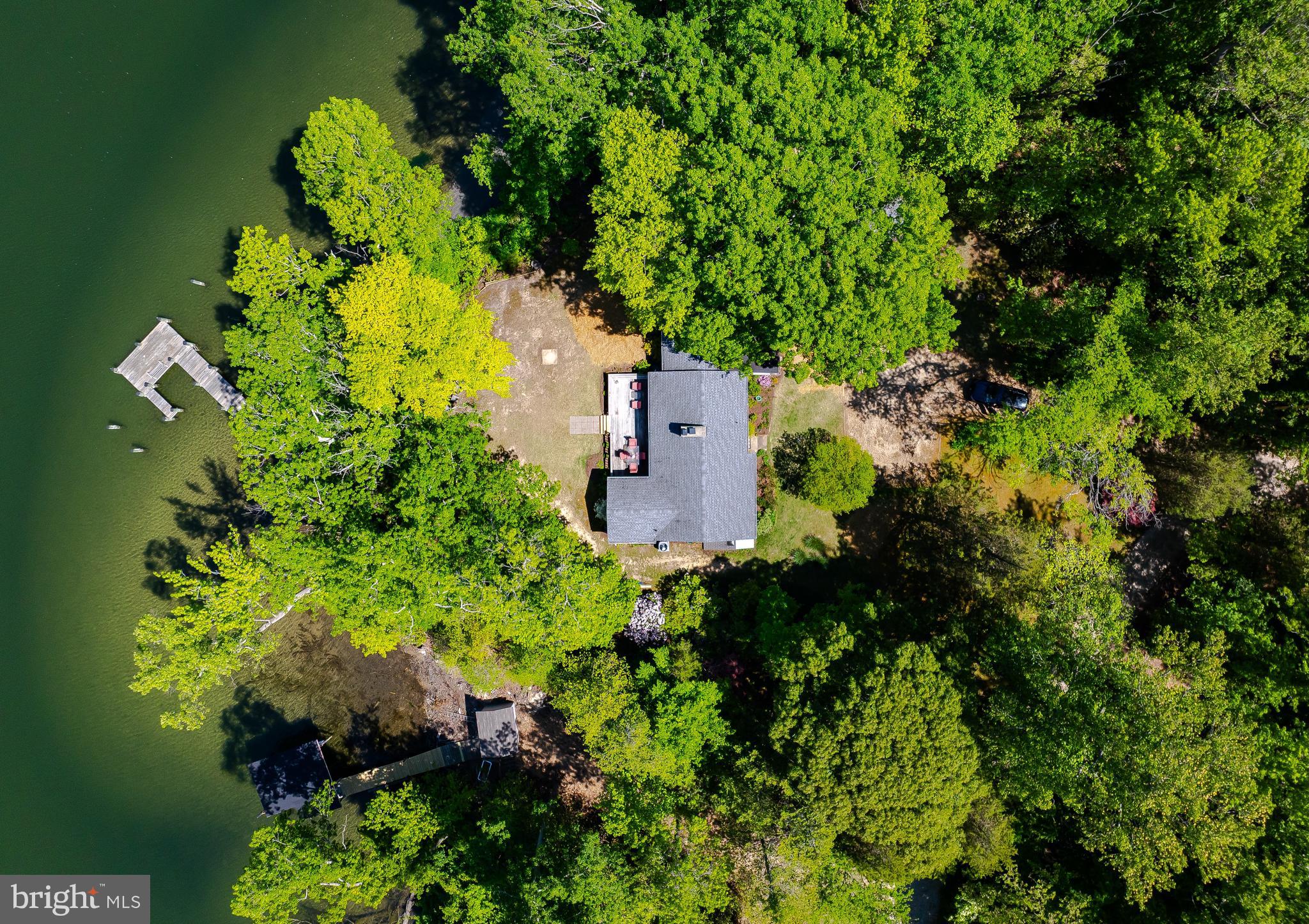 23761 Kingston Creek Road California, MD 20619 - Photo 43 of 61 an aerial view of a house with a yard and garden in back