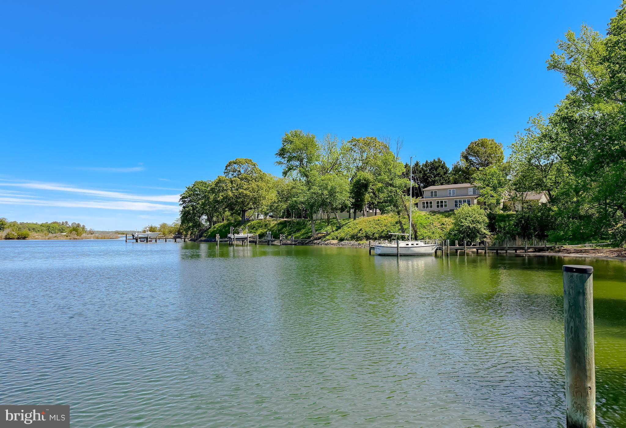 23761 Kingston Creek Road California, MD 20619 - Photo 48 of 61 a view of a lake with houses in the back