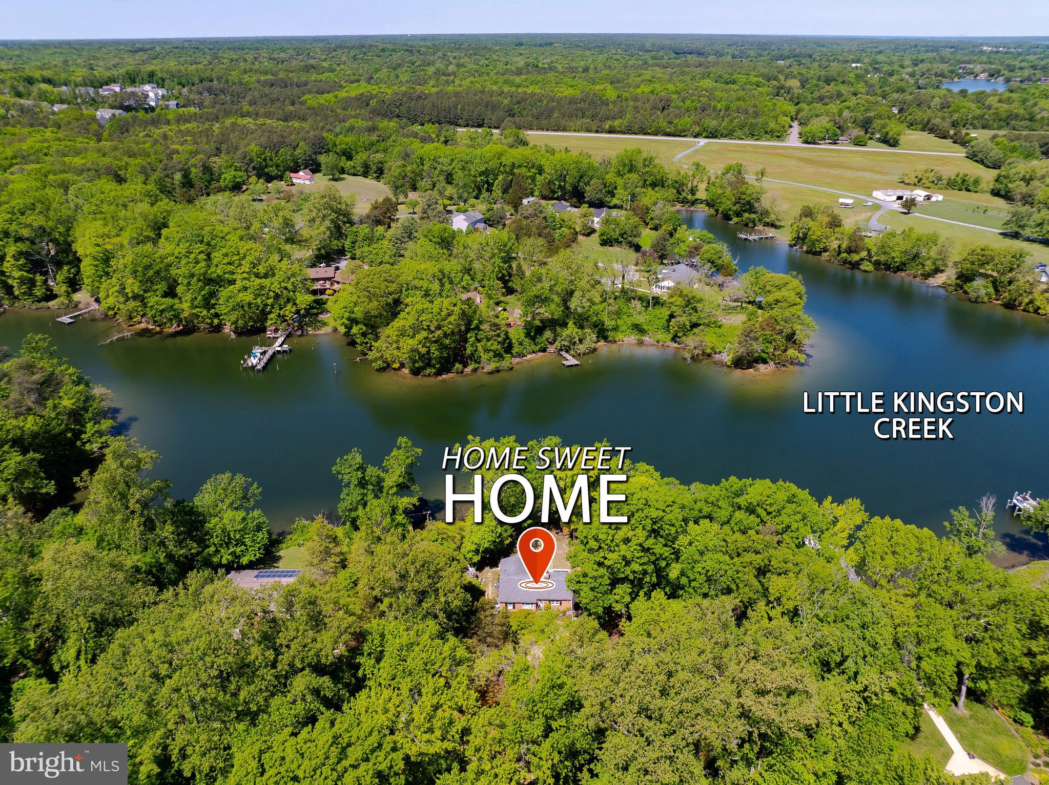 23761 Kingston Creek Road California, MD 20619 - Photo 52 of 61 an aerial view of a houses with a lake view