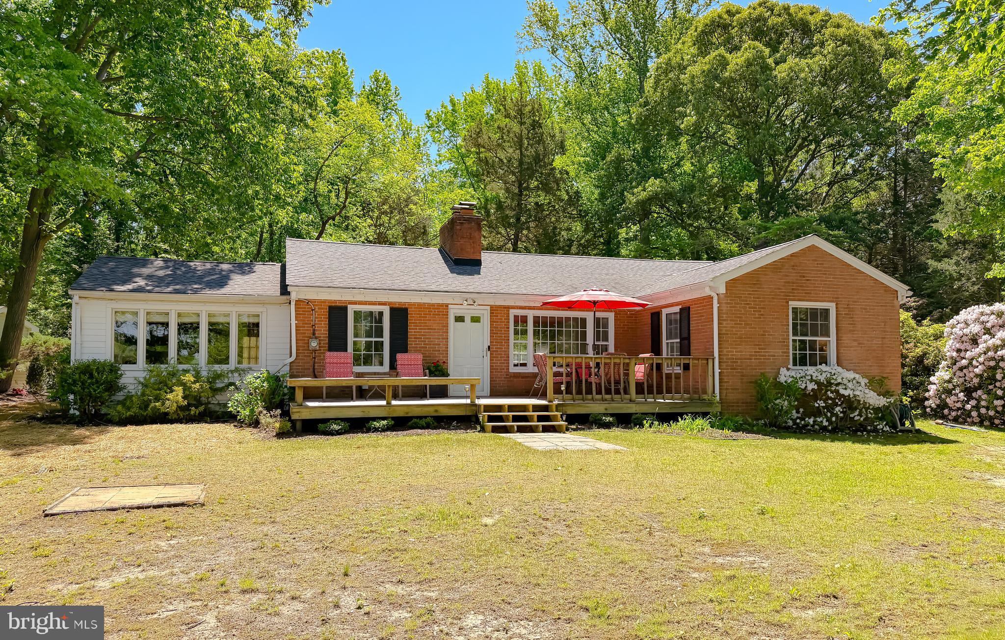 23761 Kingston Creek Road California, MD 20619 - Photo 6 of 61 a front view of a house with a yard