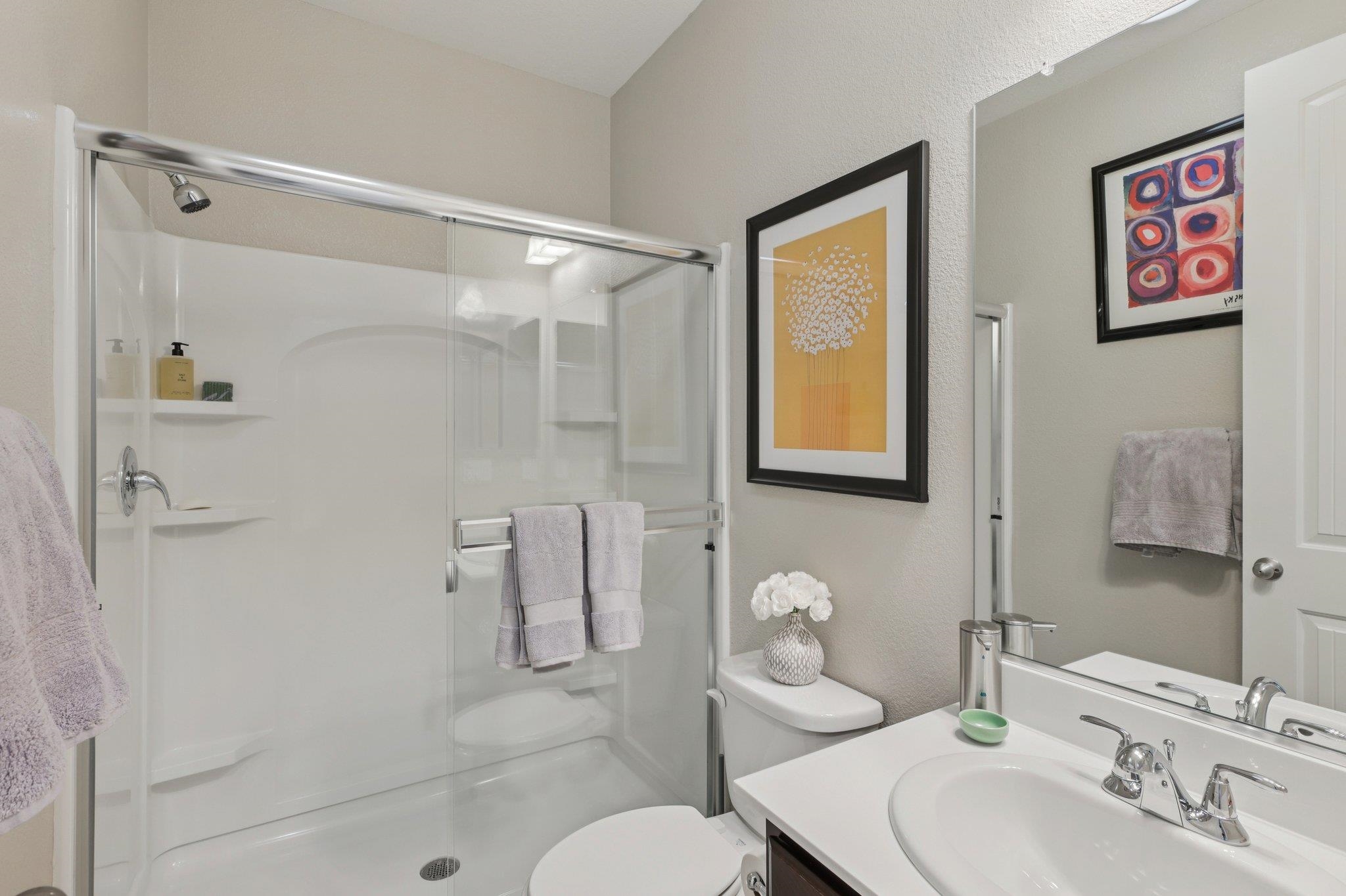 165 Little Ranch Circle Oakley, CA 94561 - Photo 20 of 60 Bathroom featuring vanity, a stall shower, and a textured wall
