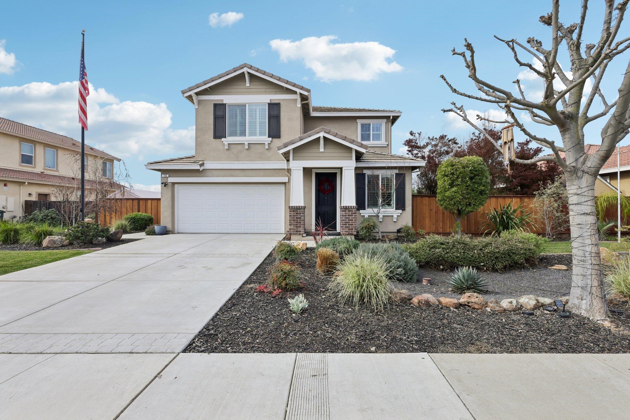 165 Little Ranch Circle Oakley, CA 94561 - Photo 2 of 60 View of front of house with concrete driveway, an attached garage, stucco siding, and brick siding