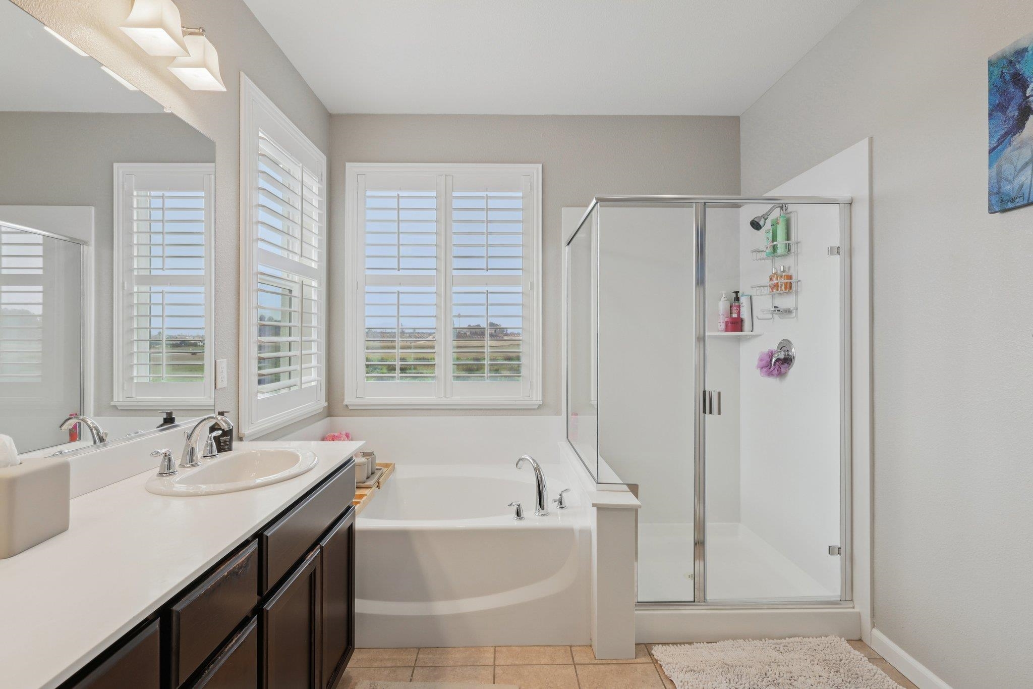 165 Little Ranch Circle Oakley, CA 94561 - Photo 33 of 60 Bathroom with a bath, vanity, a shower stall, and light tile patterned floors