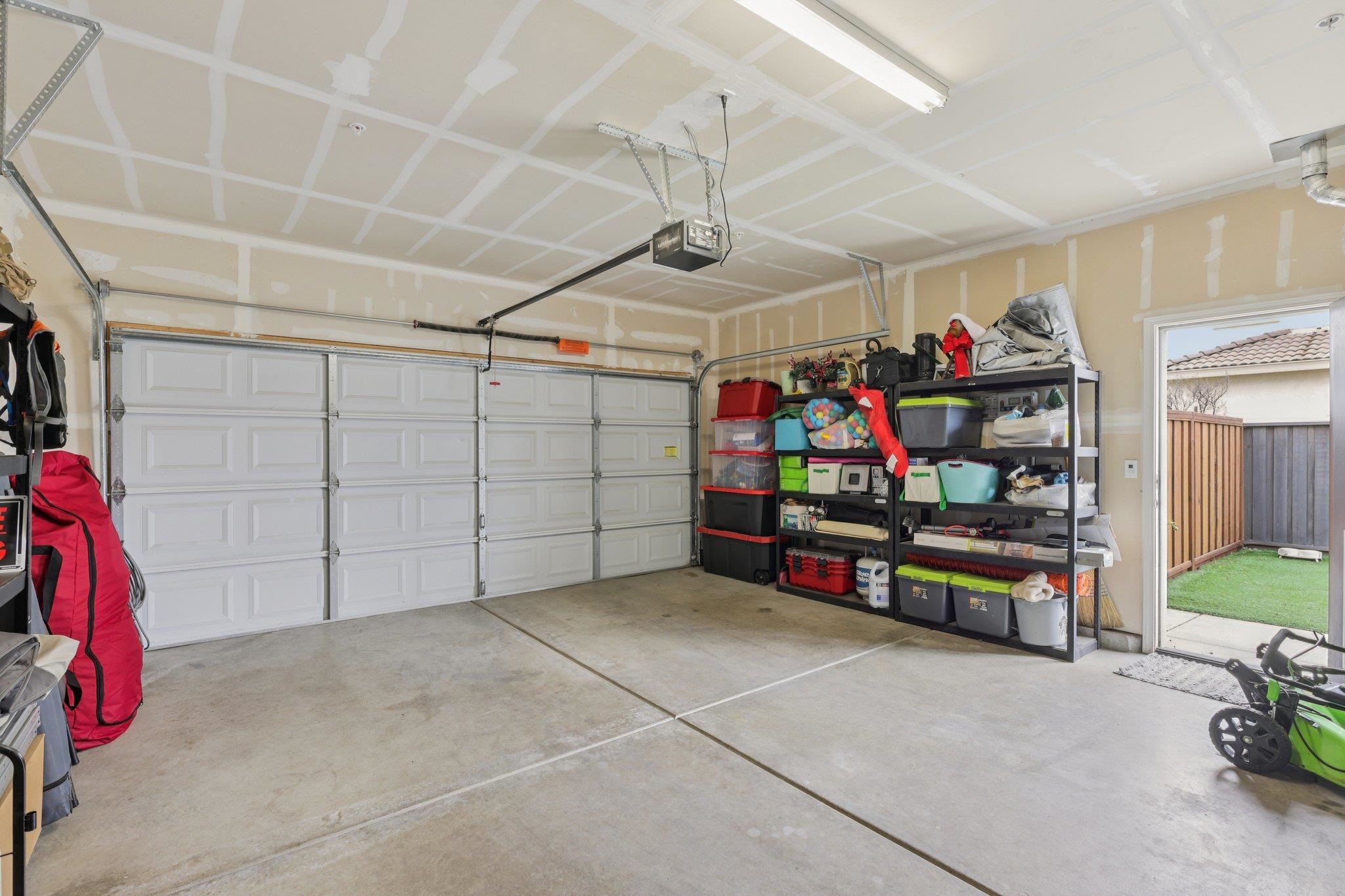 165 Little Ranch Circle Oakley, CA 94561 - Photo 38 of 60 Garage featuring a garage door opener