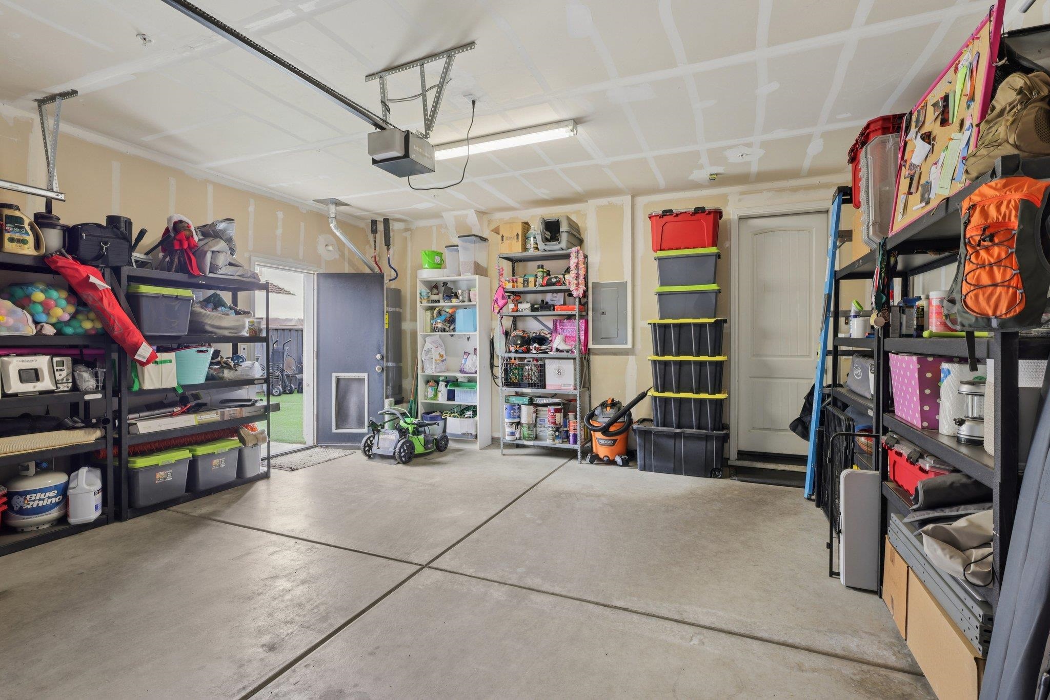 165 Little Ranch Circle Oakley, CA 94561 - Photo 39 of 60 Garage with electric panel and a garage door opener