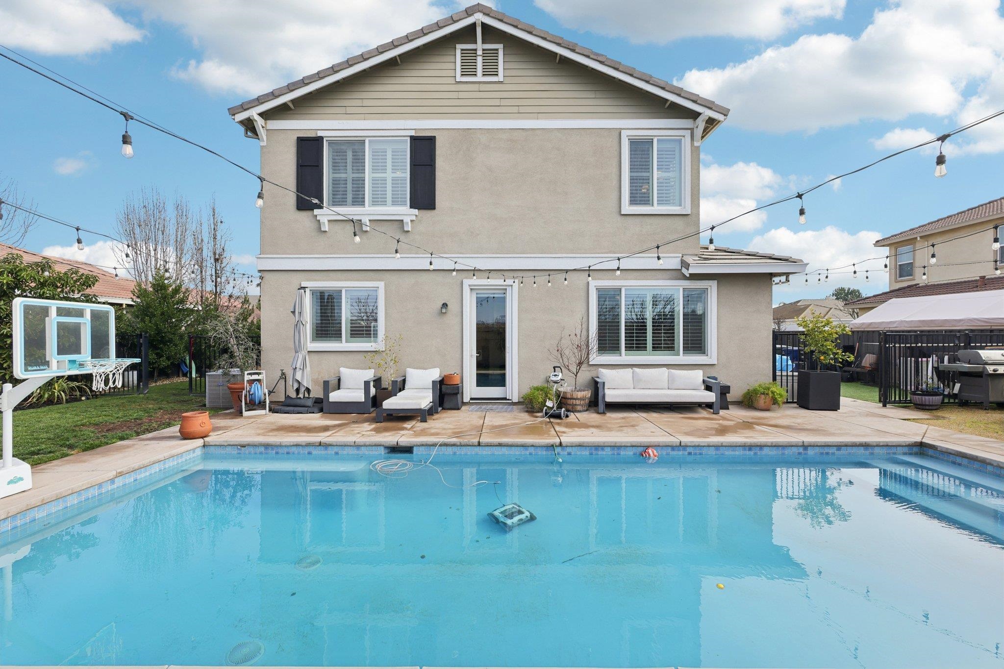 165 Little Ranch Circle Oakley, CA 94561 - Photo 44 of 60 Rear view of house featuring stucco siding, a patio, and an outdoor living space