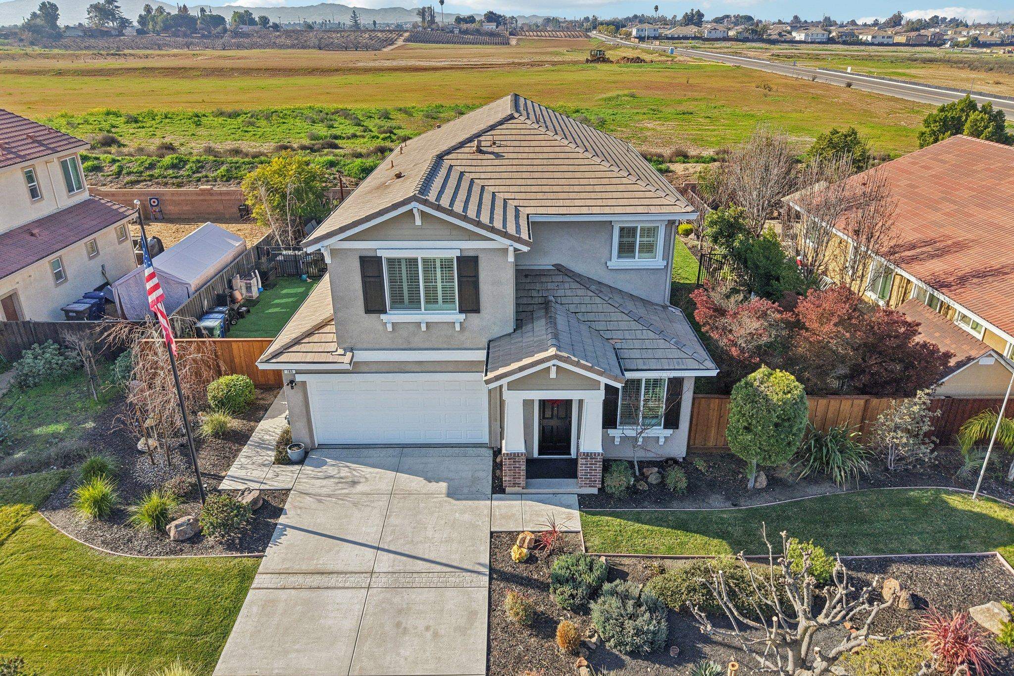 165 Little Ranch Circle Oakley, CA 94561 - Photo 50 of 60 View of front of house with stucco siding, driveway, a garage, a tile roof, and brick siding
