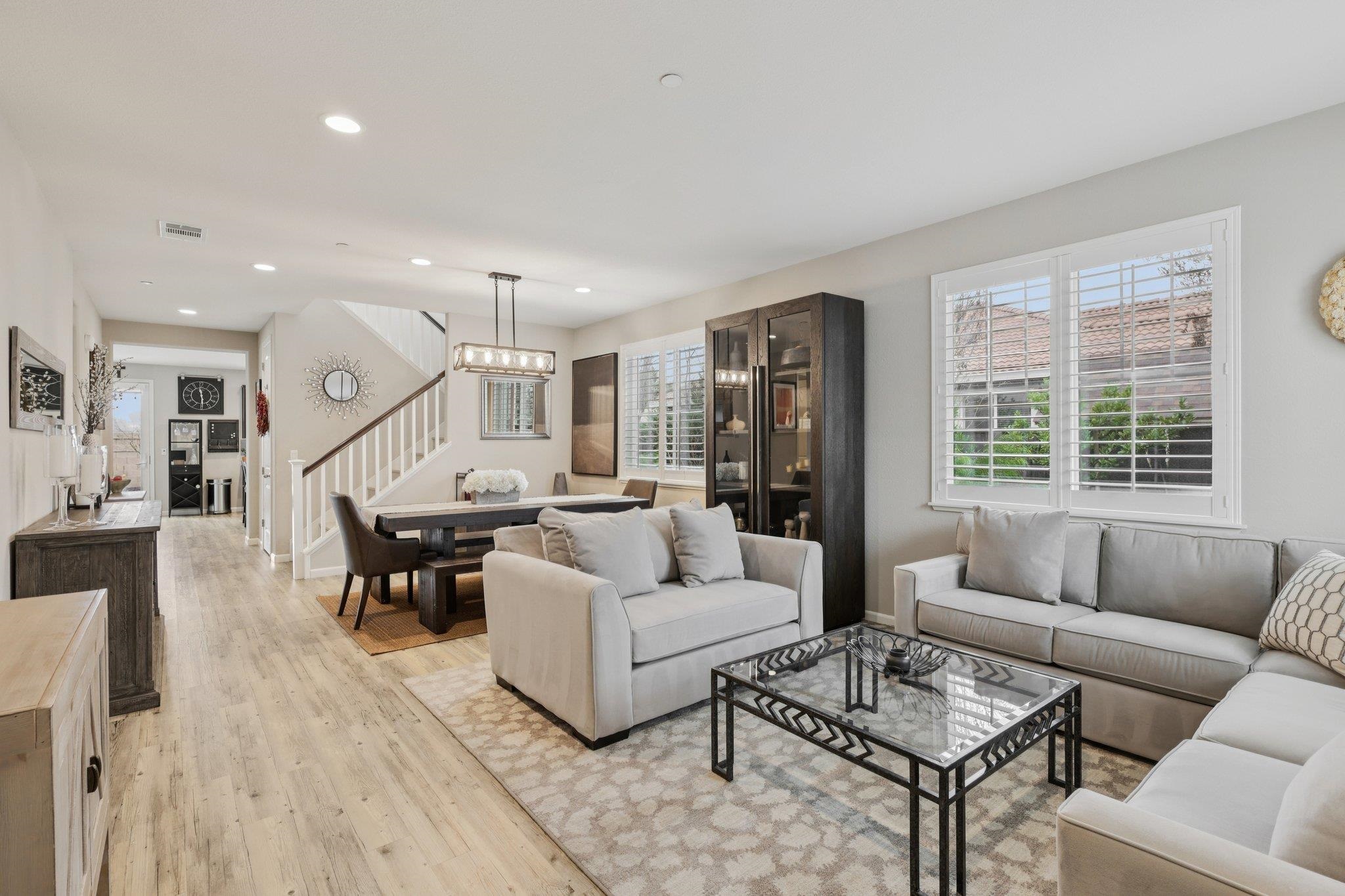 165 Little Ranch Circle Oakley, CA 94561 - Photo 7 of 60 Living room featuring healthy amount of natural light, light wood-style flooring, recessed lighting, and stairway