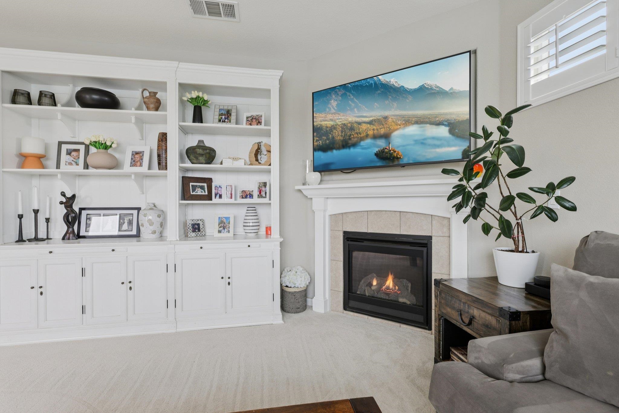 165 Little Ranch Circle Oakley, CA 94561 - Photo 9 of 60 Living room featuring a tiled fireplace and carpet flooring