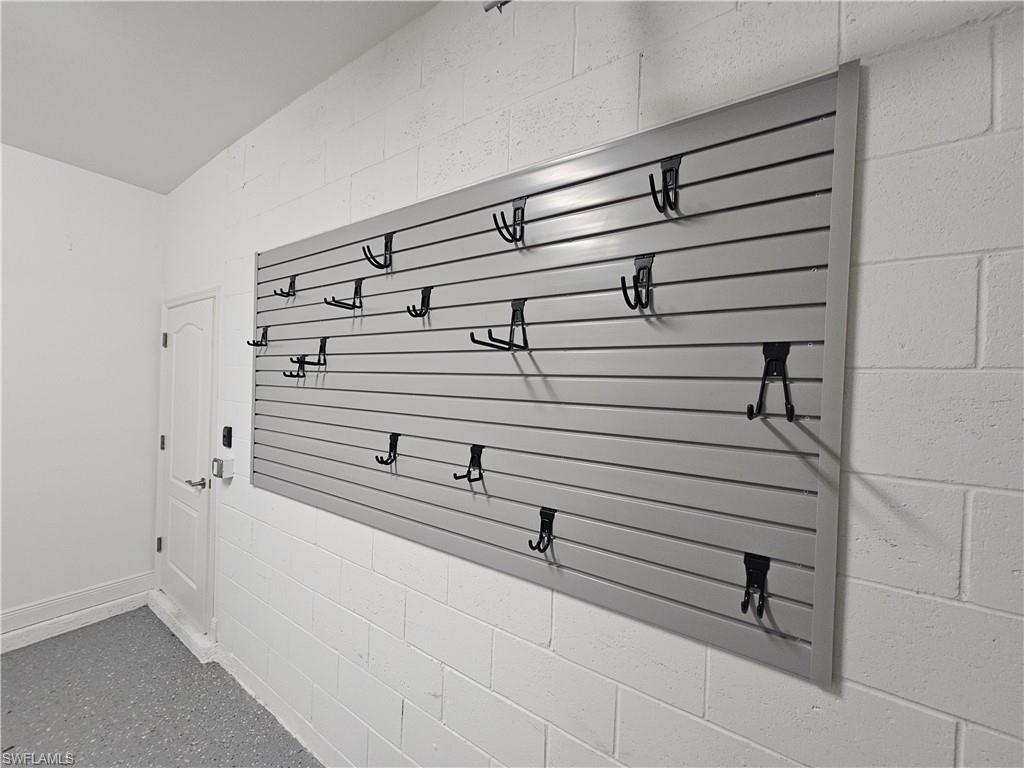 6954 Avalon Circle, Unit 703 Naples, FL 34112 - Photo 13 of 17 a view of walk in closet