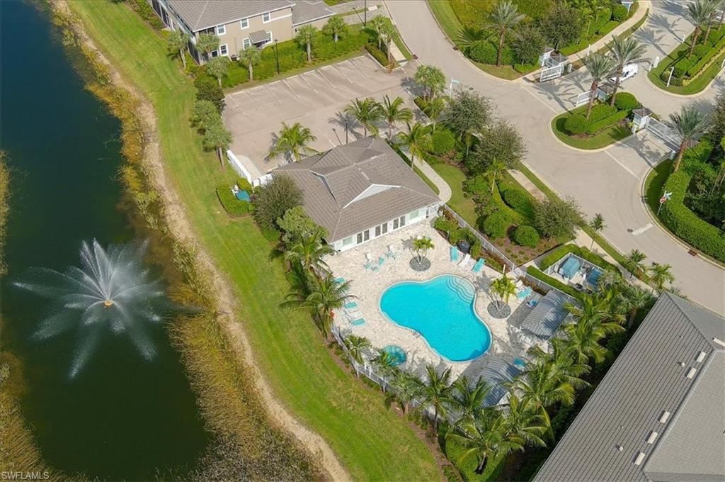 6954 Avalon Circle, Unit 703 Naples, FL 34112 - Photo 16 of 17 an aerial view of a house with a swimming pool