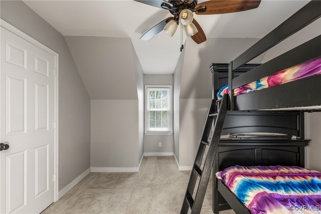 7106 Pointer Ridge Road Midlothian, VA 23112 - Photo 36 of 49 a bedroom with a bed and a chandelier