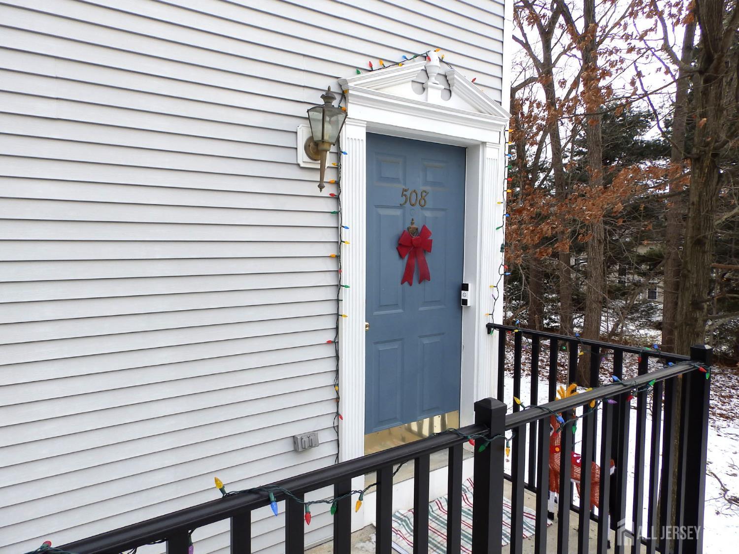 508 Cypress Lane East Brunswick, NJ 08816 - Photo 2 of 15 a view of a white house with wooden fence