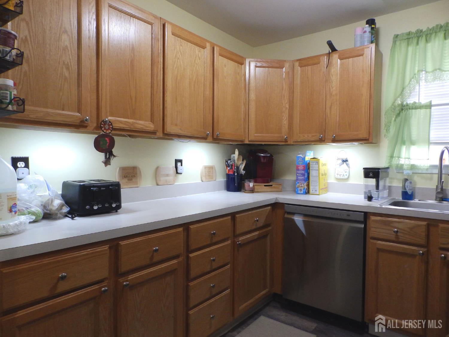 508 Cypress Lane East Brunswick, NJ 08816 - Photo 3 of 15 a kitchen with stainless steel appliances granite countertop a sink a stove and cabinets