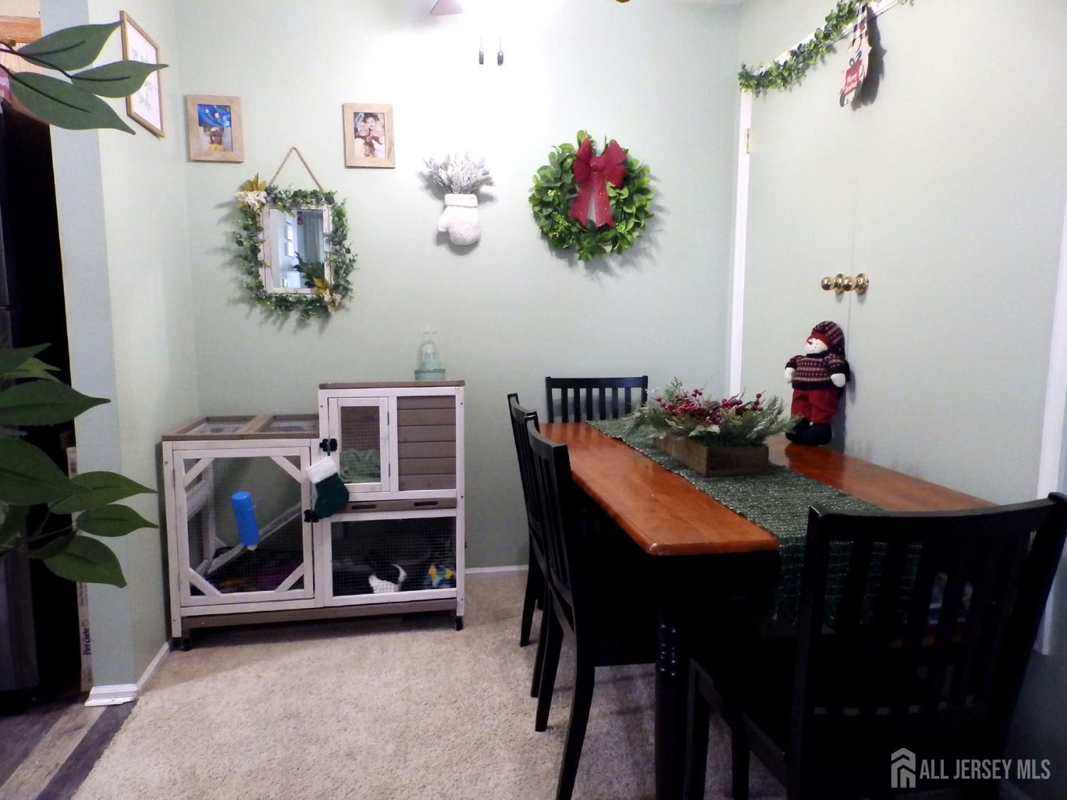 508 Cypress Lane East Brunswick, NJ 08816 - Photo 5 of 15 a dining room with furniture and a fireplace