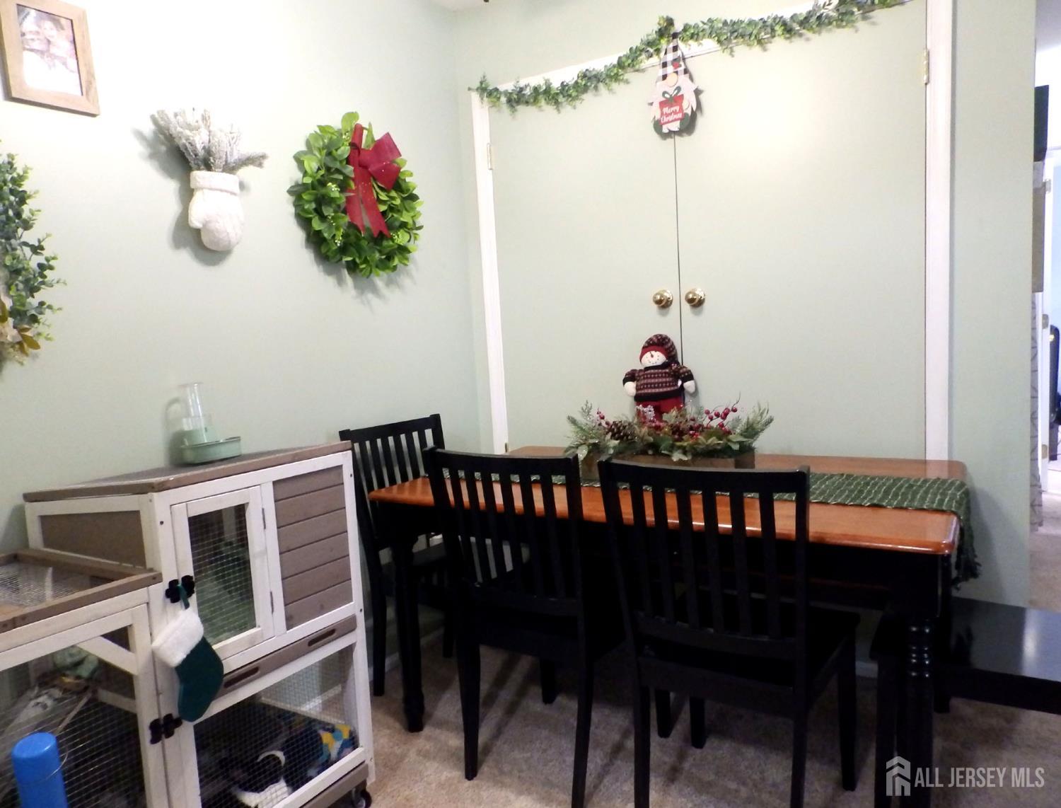508 Cypress Lane East Brunswick, NJ 08816 - Photo 6 of 15 a dining room with furniture a chandelier and wooden floor