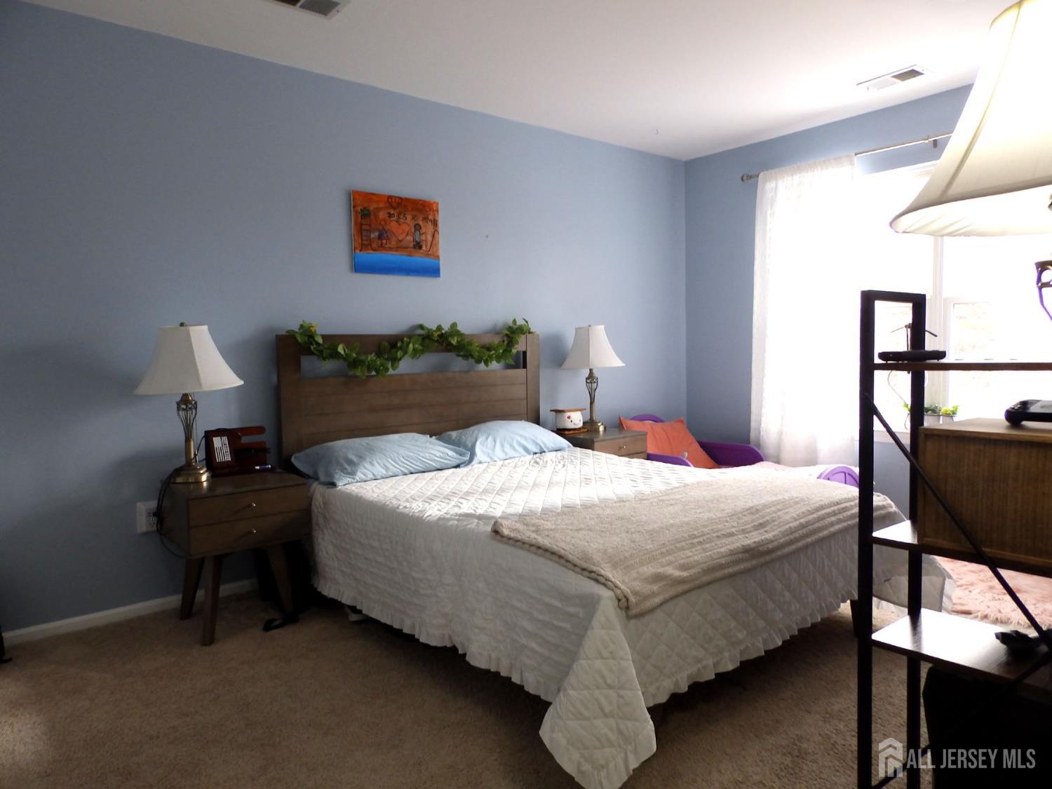 508 Cypress Lane East Brunswick, NJ 08816 - Photo 8 of 15 a bedroom with a bed and window