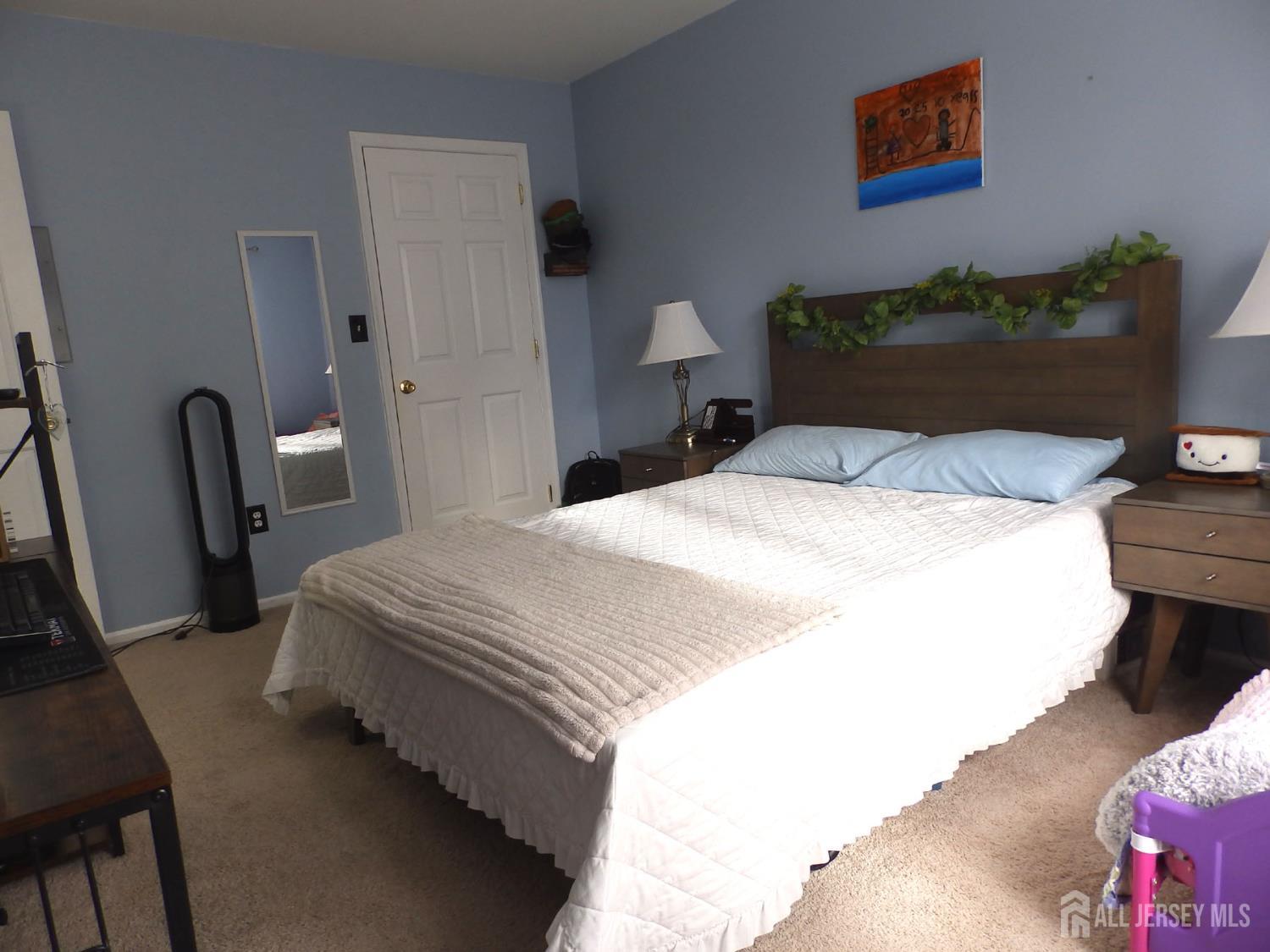 508 Cypress Lane East Brunswick, NJ 08816 - Photo 9 of 15 a bedroom with bed and a chair