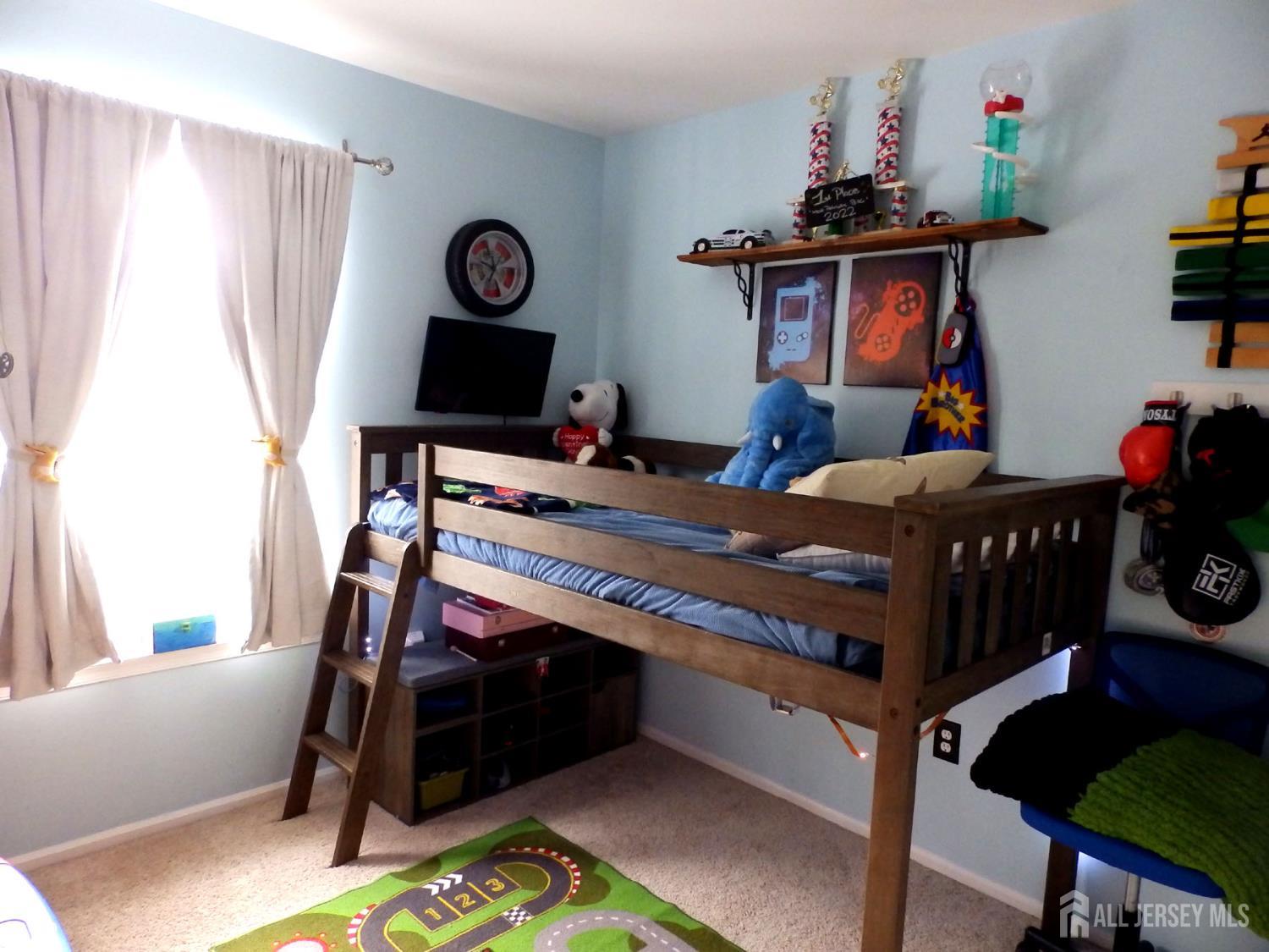 508 Cypress Lane East Brunswick, NJ 08816 - Photo 10 of 15 a bedroom with a bed and wooden floor