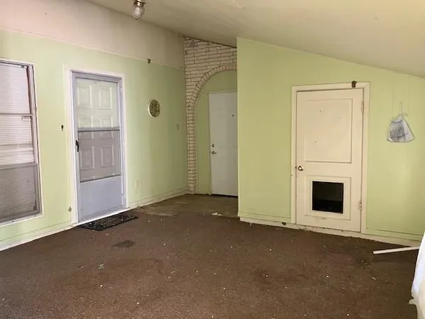 an empty room with windows