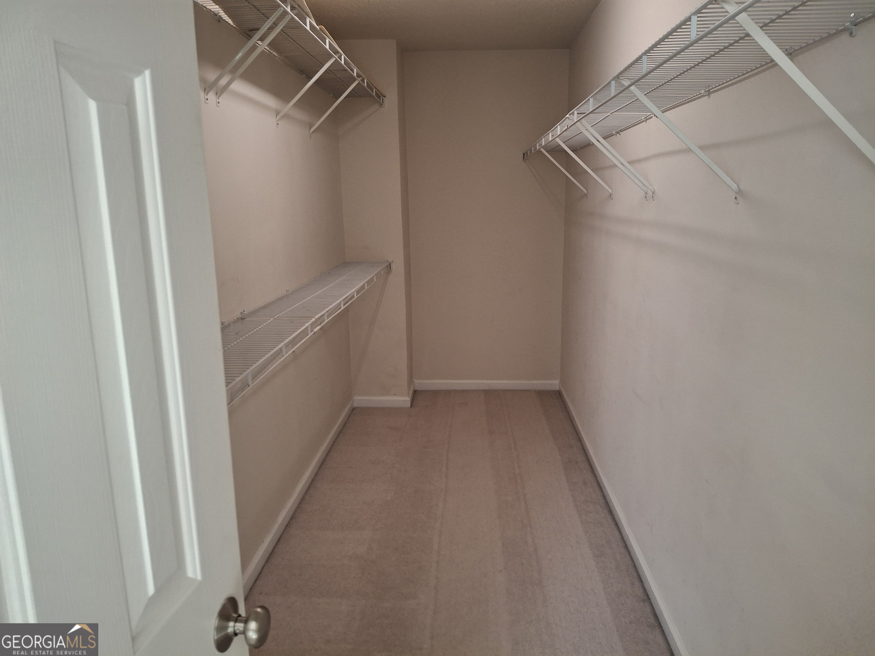 8955 Ruel Lane Suwanee, GA 30024 - Photo 10 of 13 Owner's Walk-in Closet