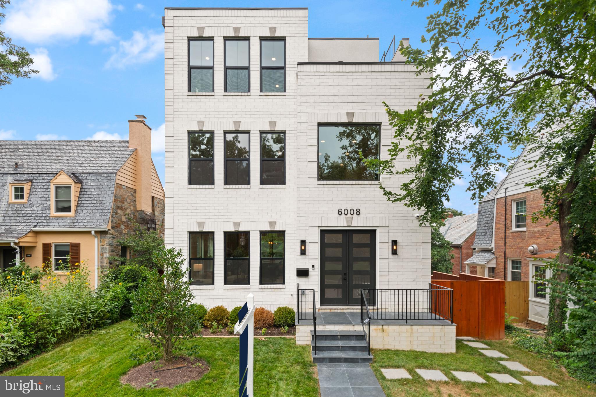 a front view of a building with garden
