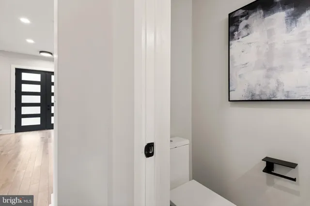 a living room with furniture and a lamp