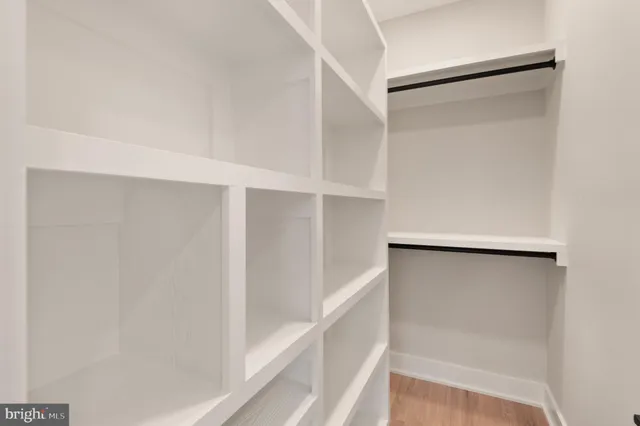 a bedroom with a large bed and a large window