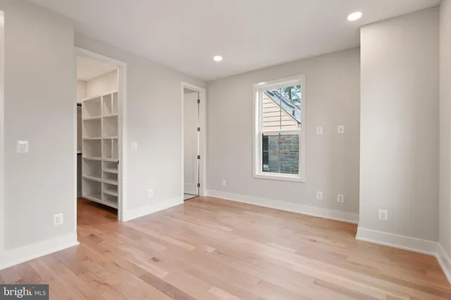 a bathroom with a sink toilet vanity and shower