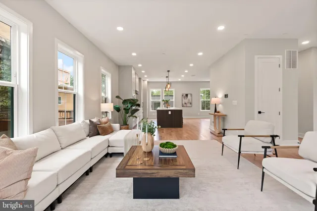 a living room with furniture and windows