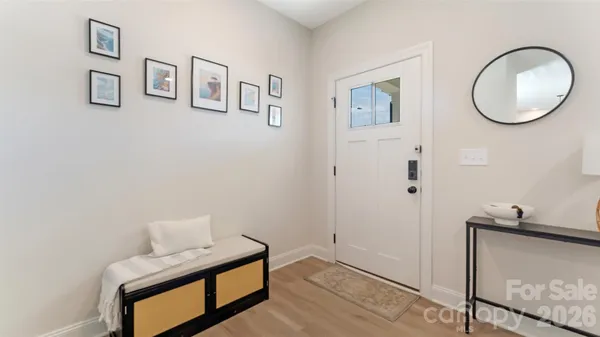 a view of room with window and flowerpot