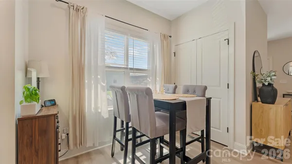 a view of a dining room with furniture and window