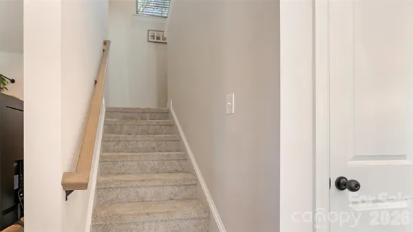 a view of a hallway with stairs